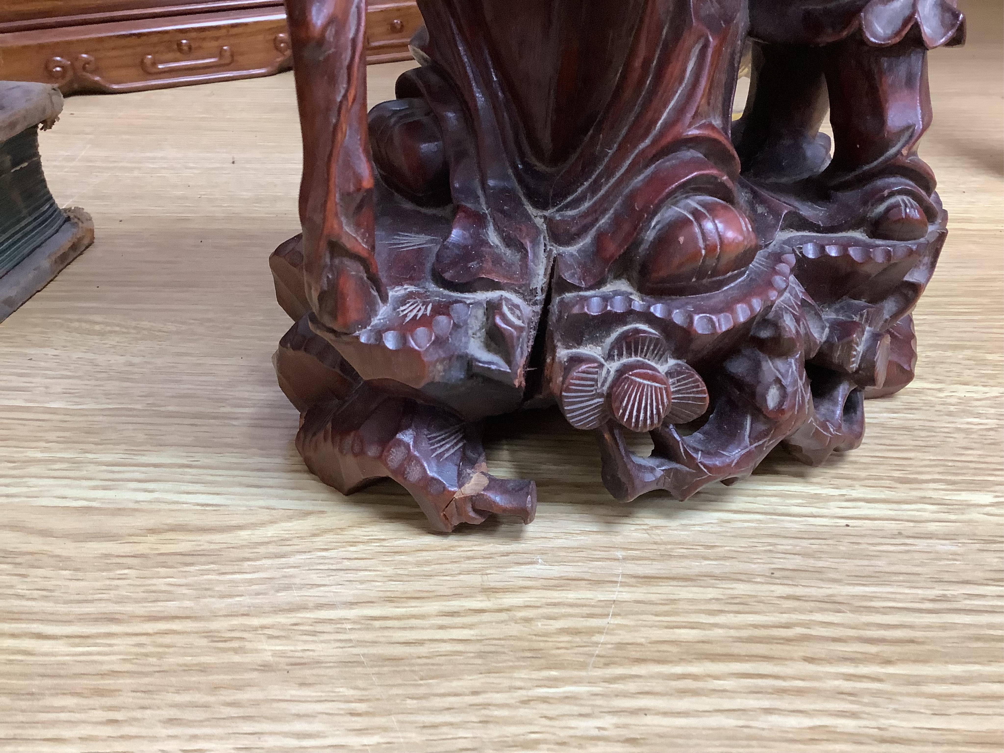 A large Chinese carved wood figure of Shouloau, 51cm high. Condition - some cracks to the wood